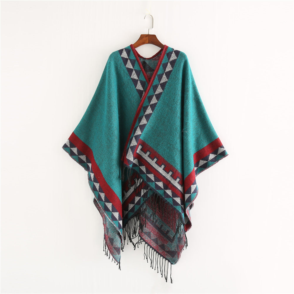 Women chunky knit poncho in wrap style with triangle jacquard and fringe hem Mune Fashion