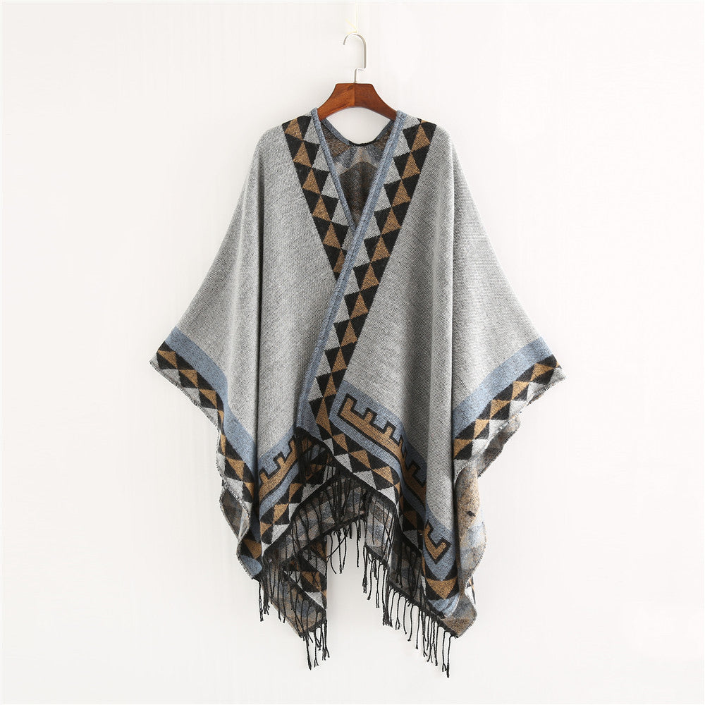 Women chunky knit poncho in wrap style with triangle jacquard and fringe hem Mune Fashion