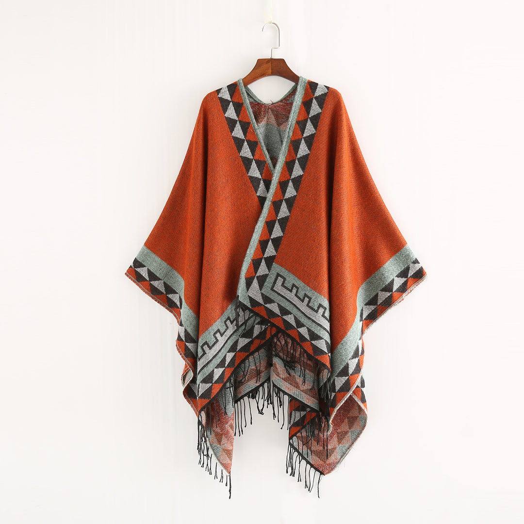 Women chunky knit poncho in wrap style with triangle jacquard and fringe hem Mune Fashion