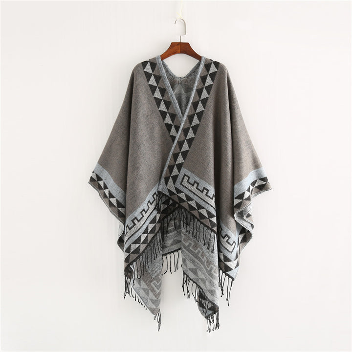 Women chunky knit poncho in wrap style with triangle jacquard and fringe hem Mune Fashion
