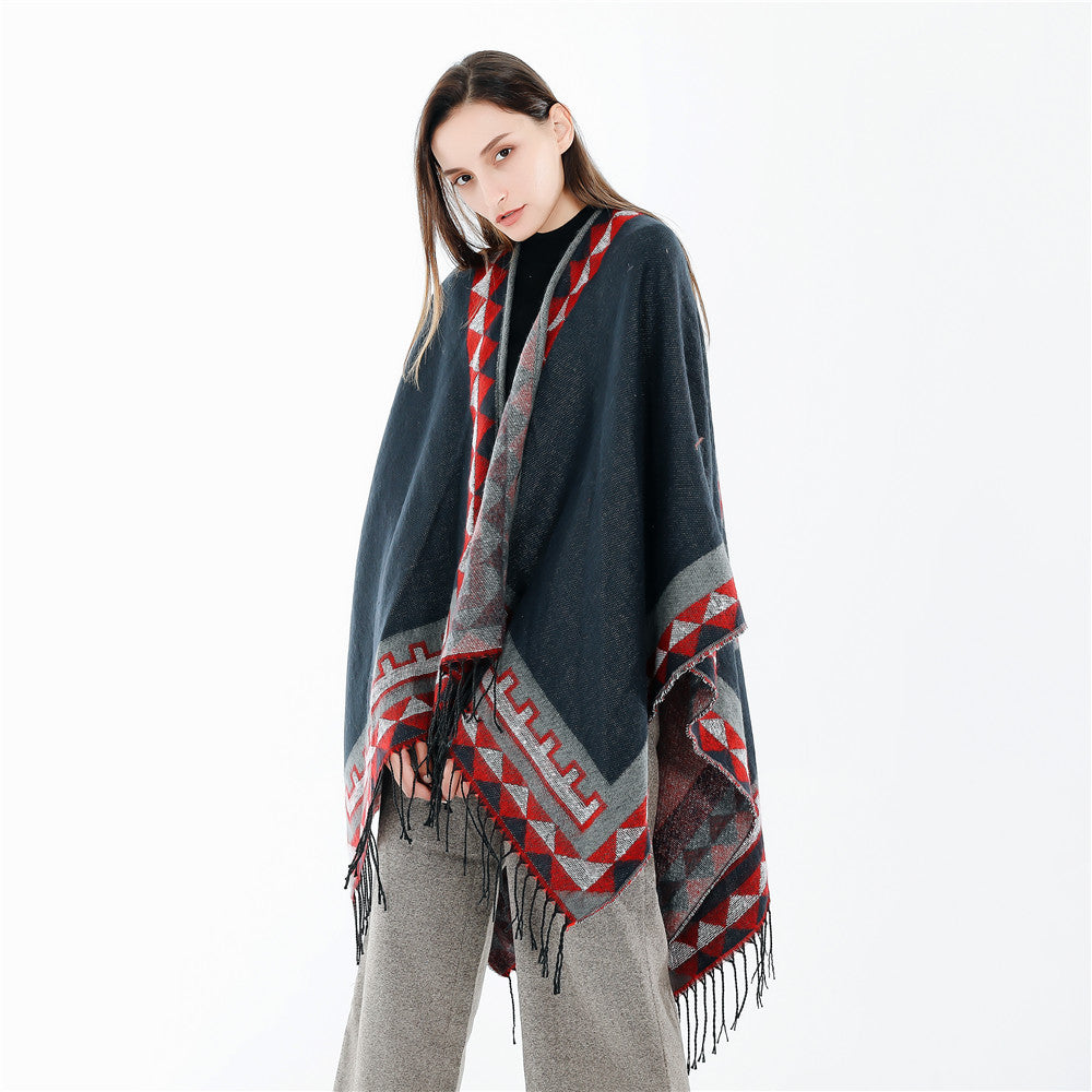 Women chunky knit poncho in wrap style with triangle jacquard and fringe hem Mune Fashion