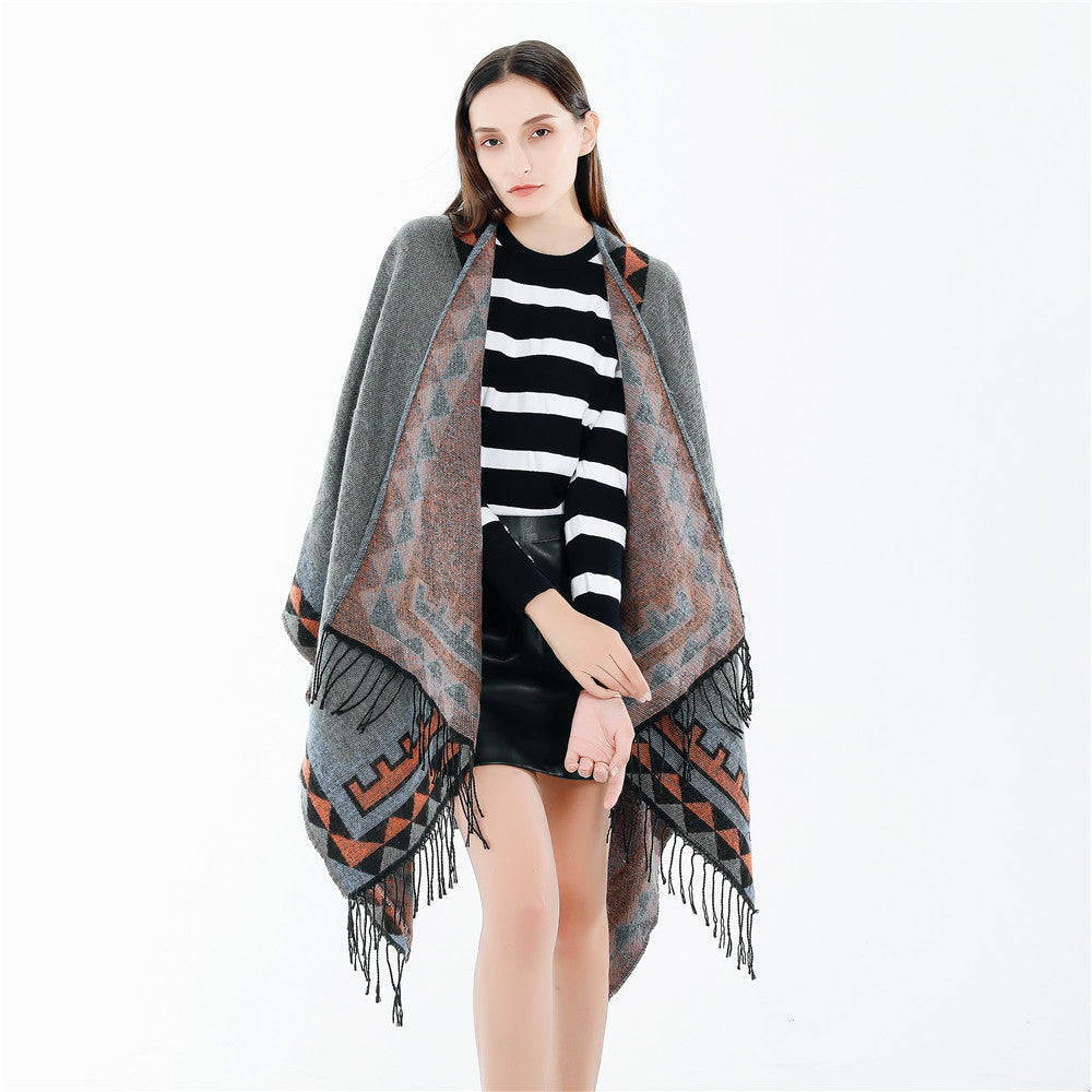 Women chunky knit poncho in wrap style with triangle jacquard and fringe hem Mune Fashion