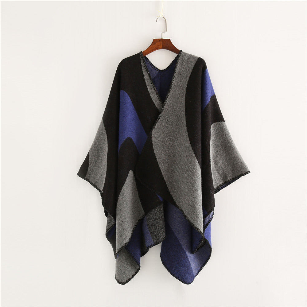 Women Soft-Falling Cape Overlay in Oversized Ruana Style with Contrasting Round Surfaces and Decorative Chain Stitching.