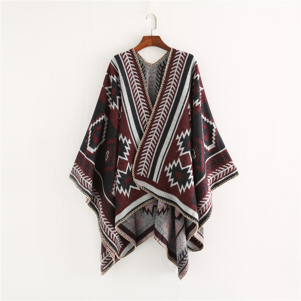 Women Ethno-Jacquard Ruana-Poncho with boxy oversized fit and decorative chain stitch.