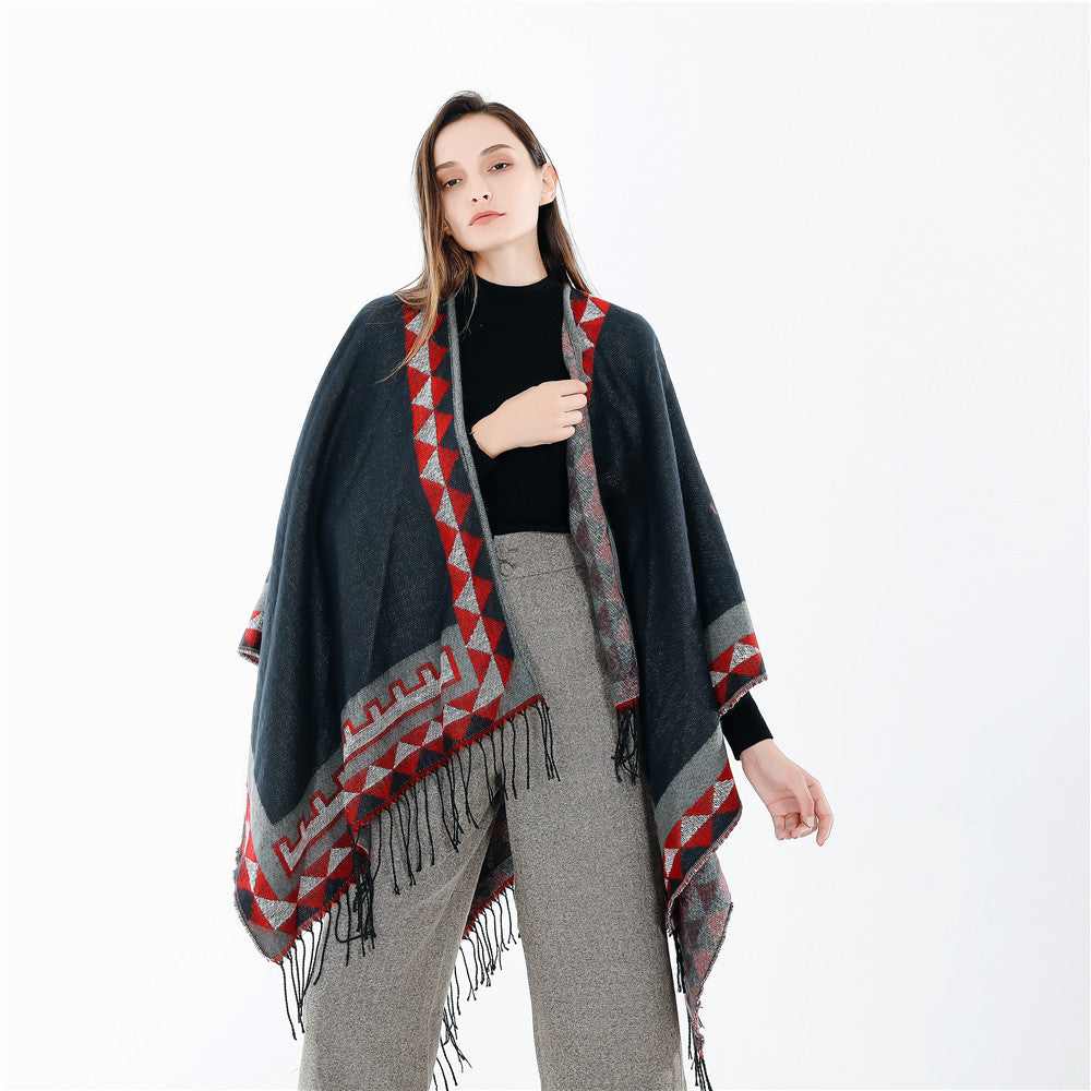 Women chunky knit poncho in wrap style with triangle jacquard and fringe hem Mune Fashion