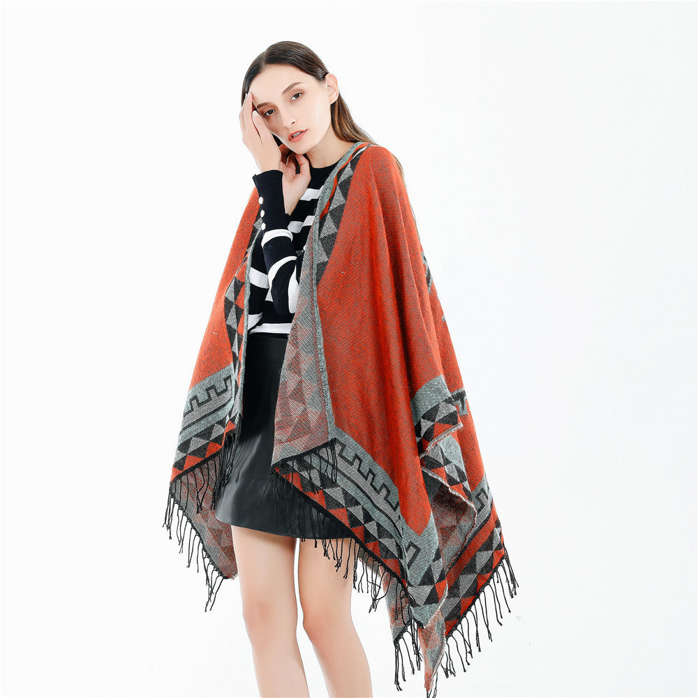 Women chunky knit poncho in wrap style with triangle jacquard and fringe hem Mune Fashion
