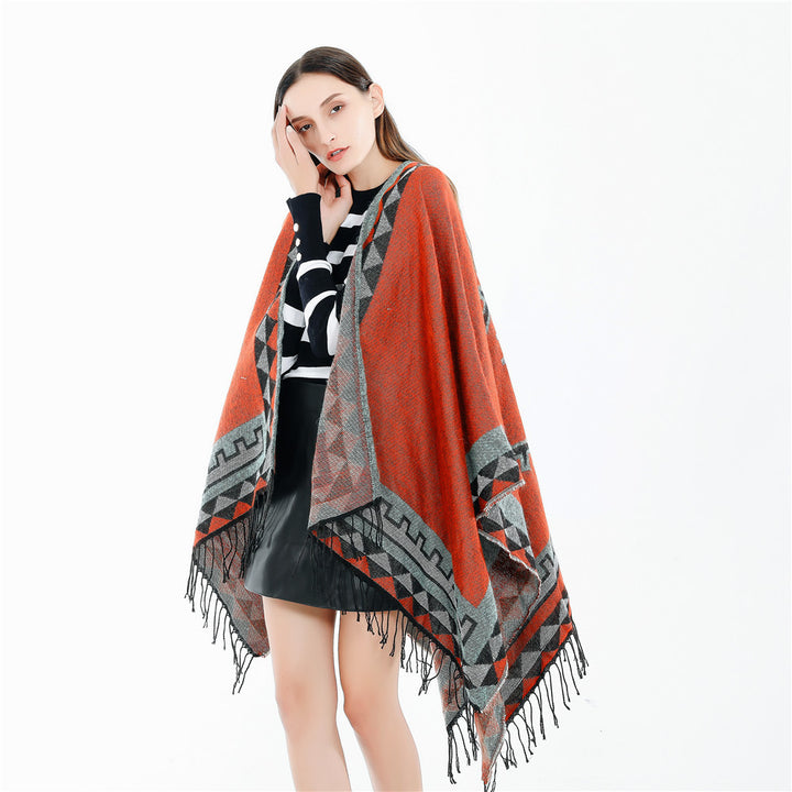 Women chunky knit poncho in wrap style with triangle jacquard and fringe hem Mune Fashion