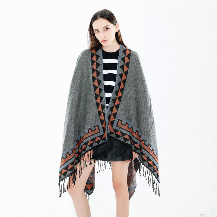 Women chunky knit poncho in wrap style with triangle jacquard and fringe hem Mune Fashion