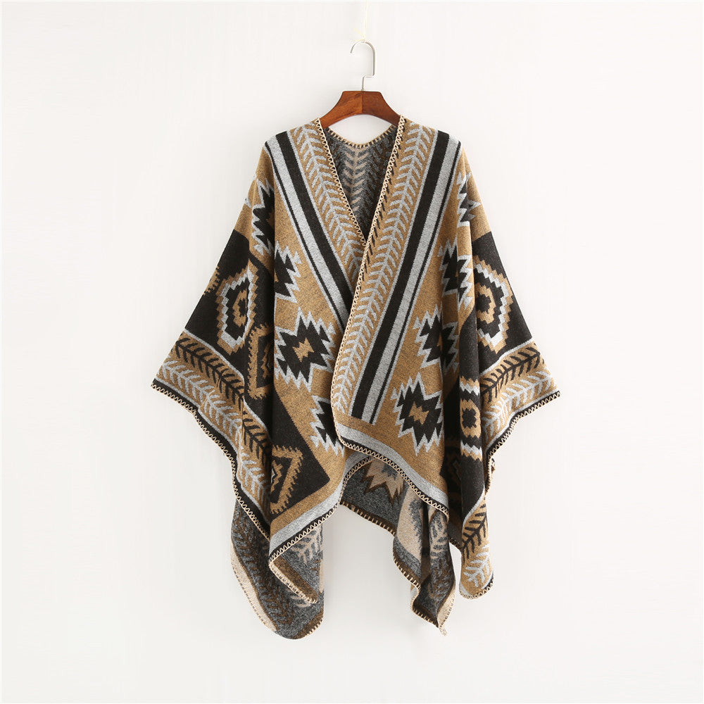 Women Ethno-Jacquard Ruana-Poncho with boxy oversized fit and decorative chain stitch.