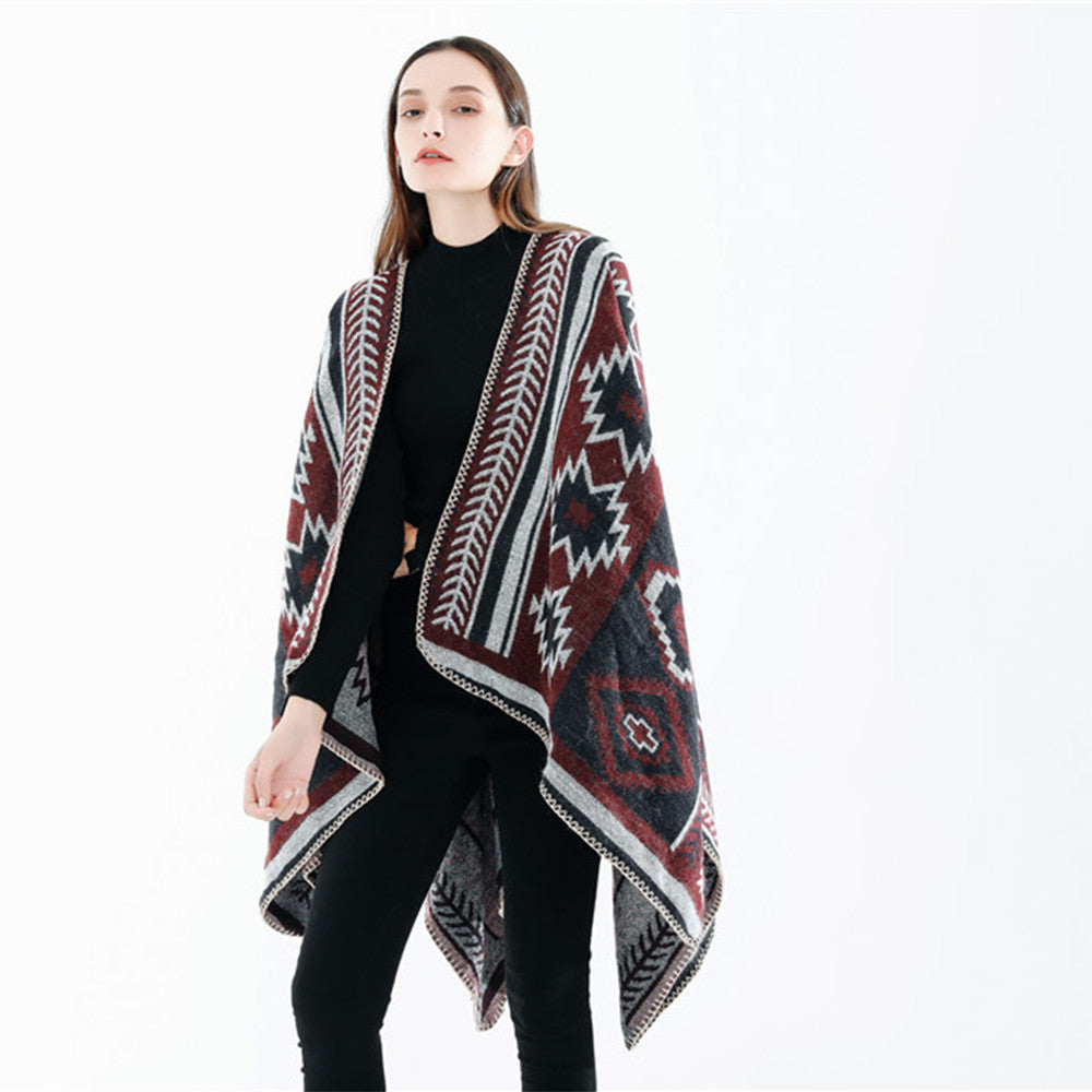 Women Ethno-Jacquard Ruana-Poncho with boxy oversized fit and decorative chain stitch.