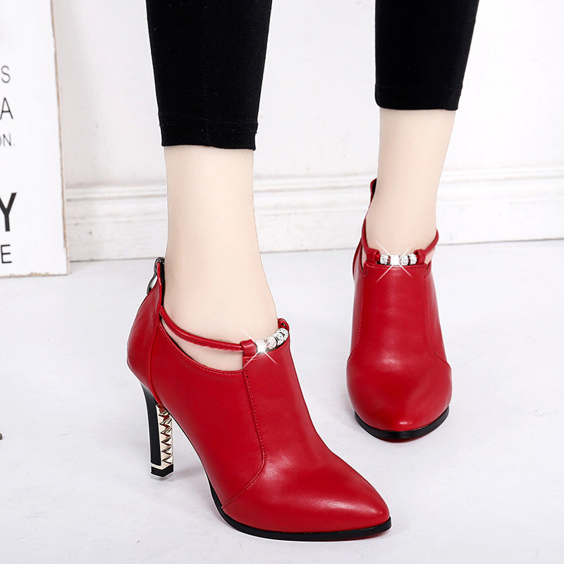 Women's elegant ankle-high boot with pointed shape, decorative strap, and gold-plated stiletto heel Mune Fashion