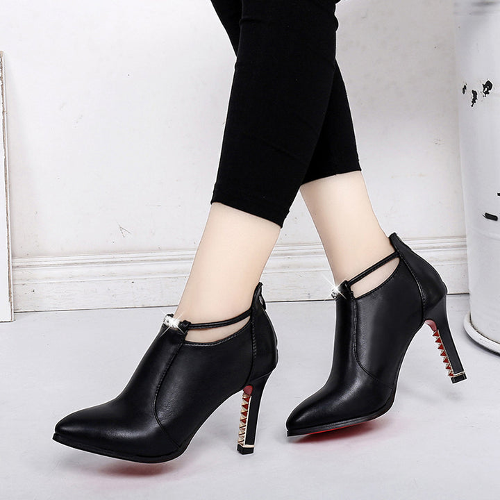 Women's elegant ankle-high boot with pointed shape, decorative strap, and gold-plated stiletto heel Mune Fashion