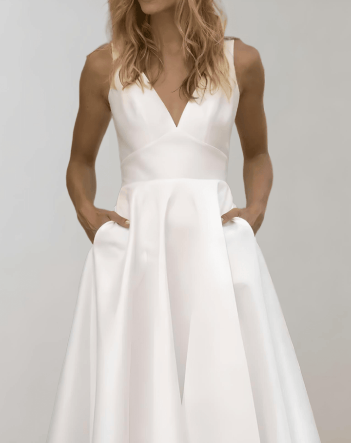 Mune Fashion | White Minimalist Bridal Dress With Deep V-Neck And Pockets