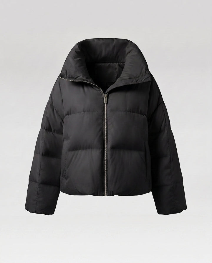 Women's cropped quilted jacket with oversized hood, lightweight thermal filling, and rounded hem