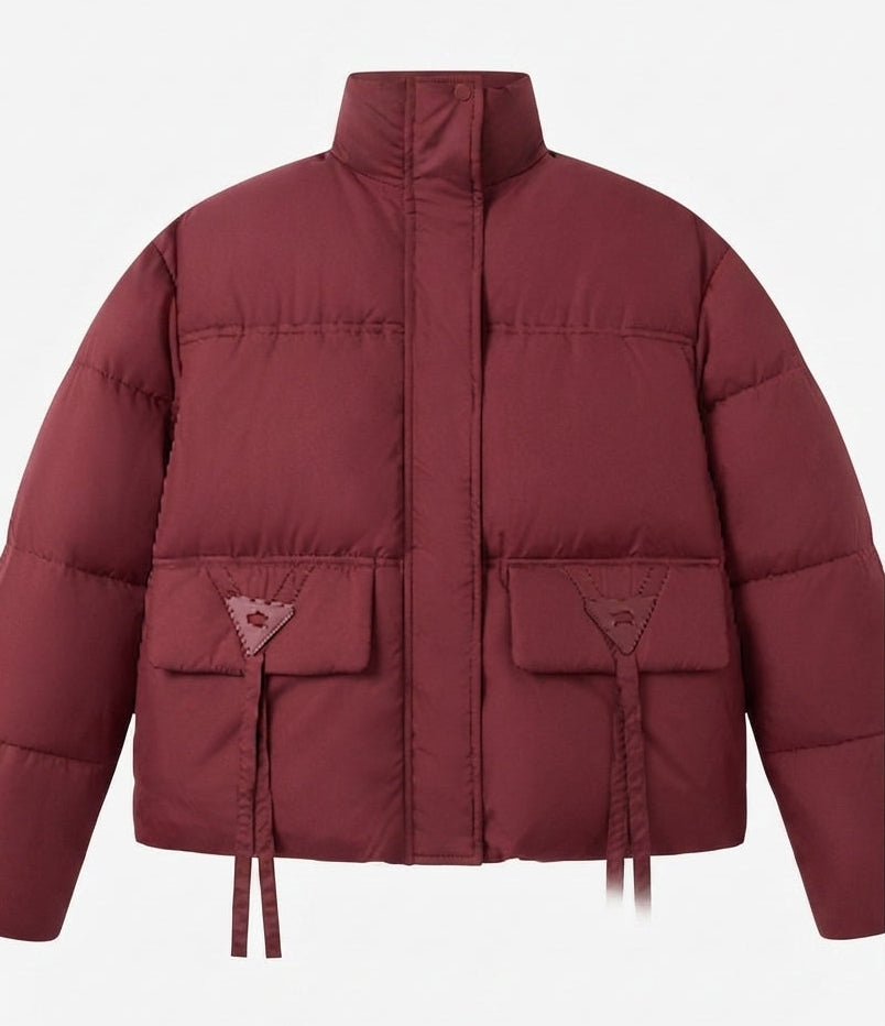 Women's short vegan boxy puffer jacket with asymmetrical flap patch pockets and high collar