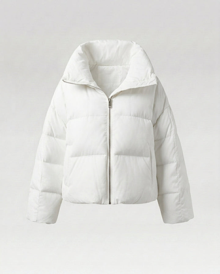 Women's cropped quilted jacket with oversized hood, lightweight thermal filling, and rounded hem