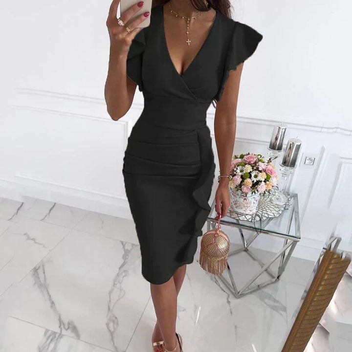 With gathered sleeves and a V-neck