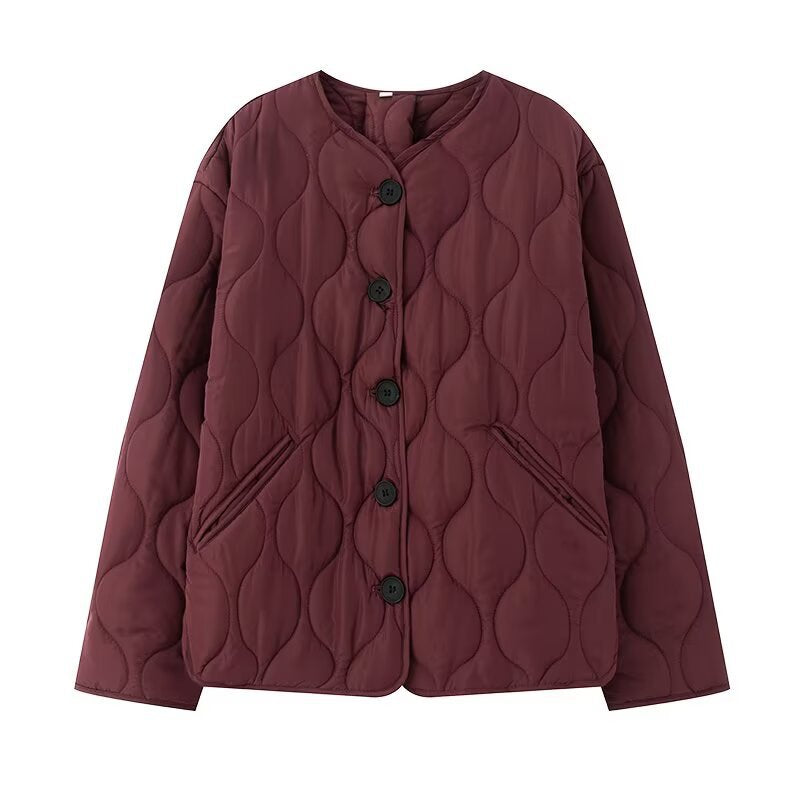 Women's quilted jacket without collar with round neckline, boxy cut and decorative wave quilting Mune Fashion
