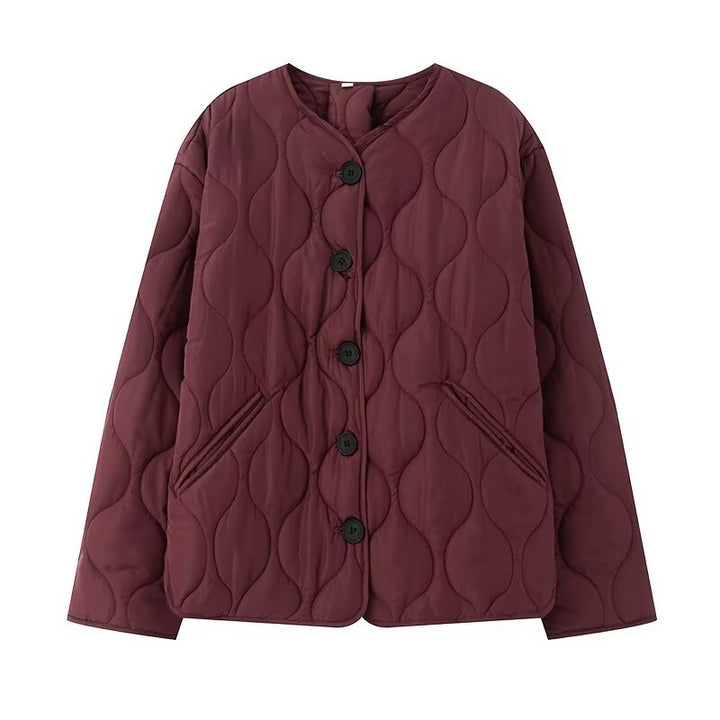 Women's quilted jacket without collar with round neckline, boxy cut and decorative wave quilting Mune Fashion