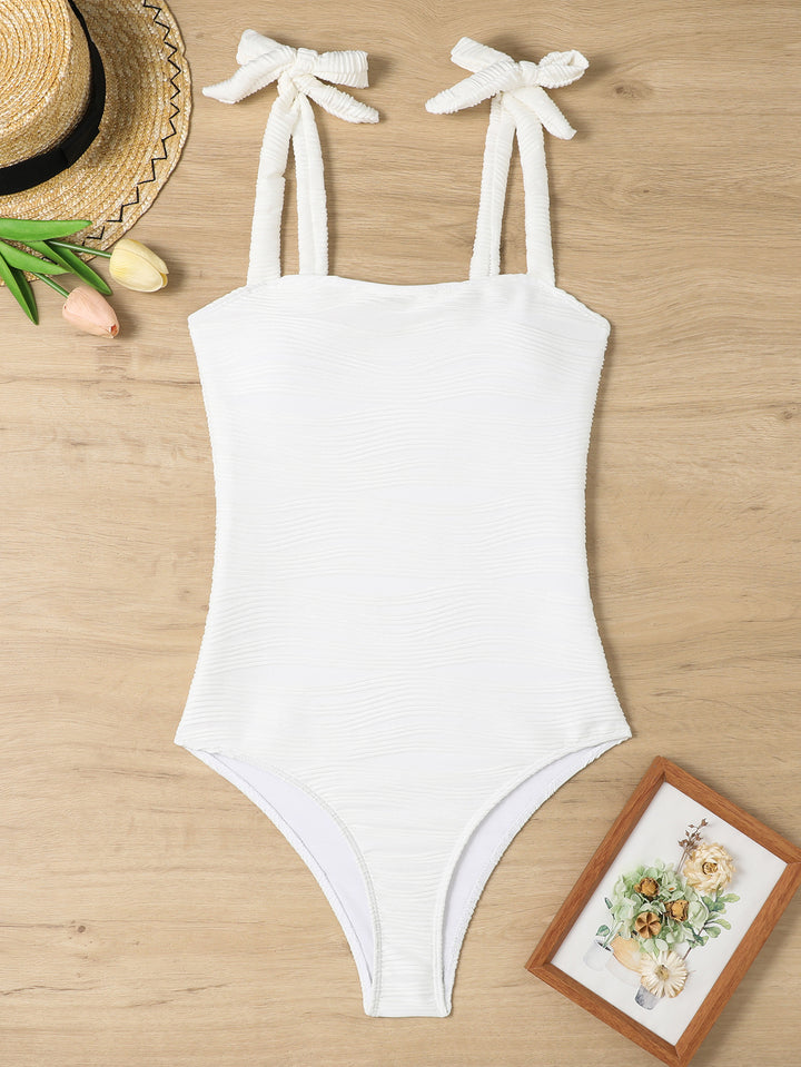 Women's figure-fitting one-piece swimsuit with playful bow details Mune Fashion