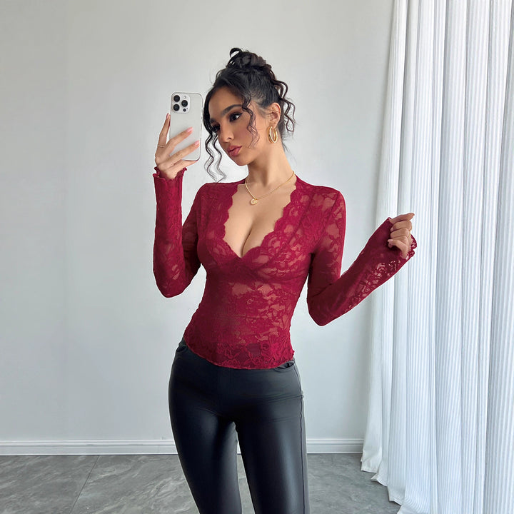 Women's fitted lace long-sleeve top with curved V-neckline, floral transparency, and flared cuffs Mune Fashion