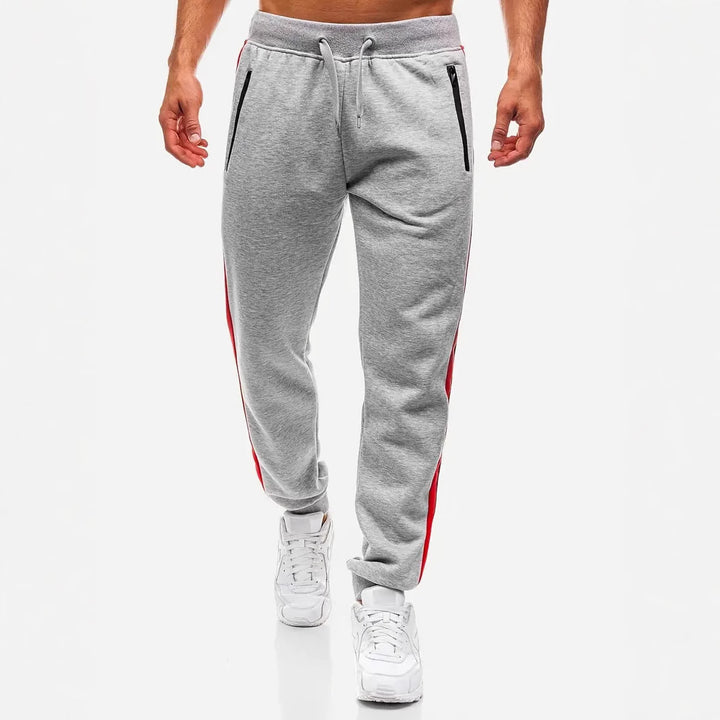 Men's narrow tapered fleece jogging pants with two-tone side piping and water-repellent zip pockets Mune Fashion