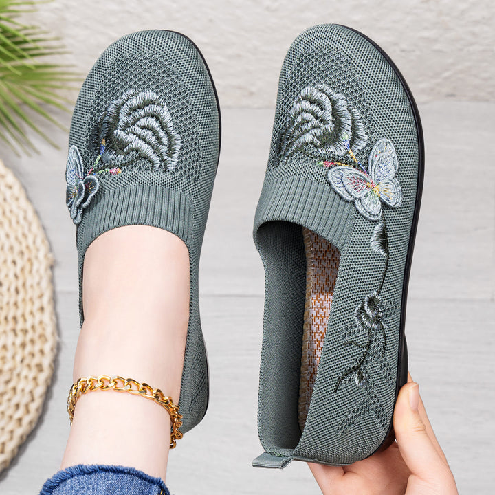 Women's embroidered knitted slipper with sock-like entry, floral embroidery design, and cushioned lightweight sole Mune Fashion