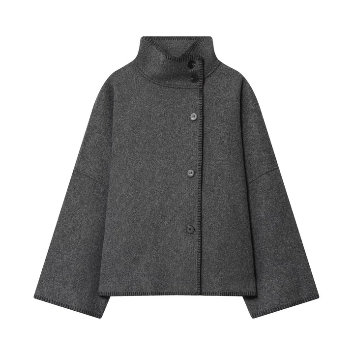 Ladies oversized wool cape jacket with high collar and asymmetrical button placket Mune Fashion