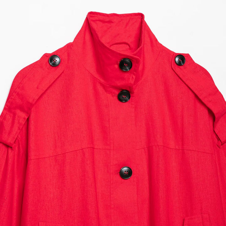Women's short cape jacket in boxy cropped trench style with stand collar and shoulder patches Mune Fashion