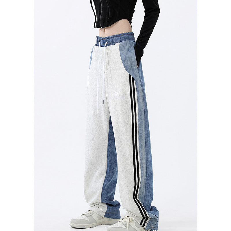 Ladies loose-fitting jogging pants with denim inserts, elastic waistband, and side contrast stripes Mune Fashion