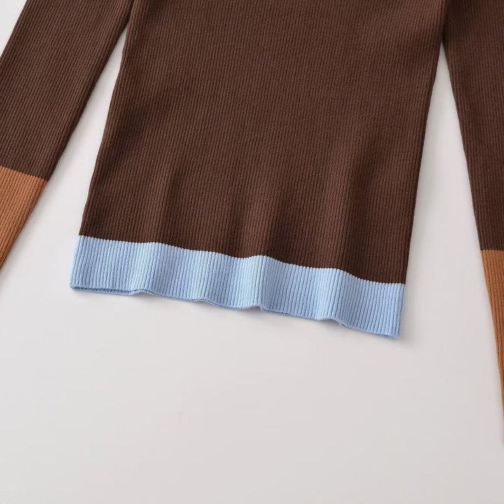 Women's figure-hugging ribbed knit sweater with polo collar, button placket, and color block details Mune Fashion