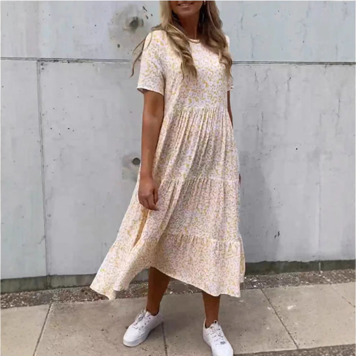 Women's flowing tiered maxi dress in Boho babydoll style with gathered underbust and short sleeves Mune Fashion