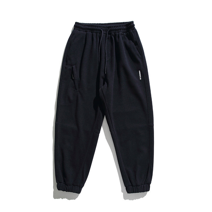 Unisex wide jogging pants in oversized cut with elastic waistband, knee panel and ribbed cuffs Mune Fashion