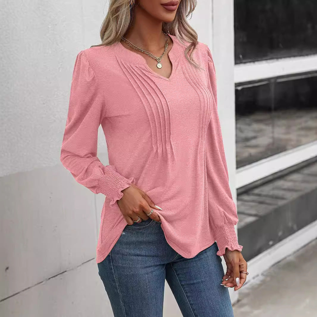 Women's long sleeve shirt with V-neckline, decorative inverted pleats at the front and elastic smocked cuffs Mune Fashion
