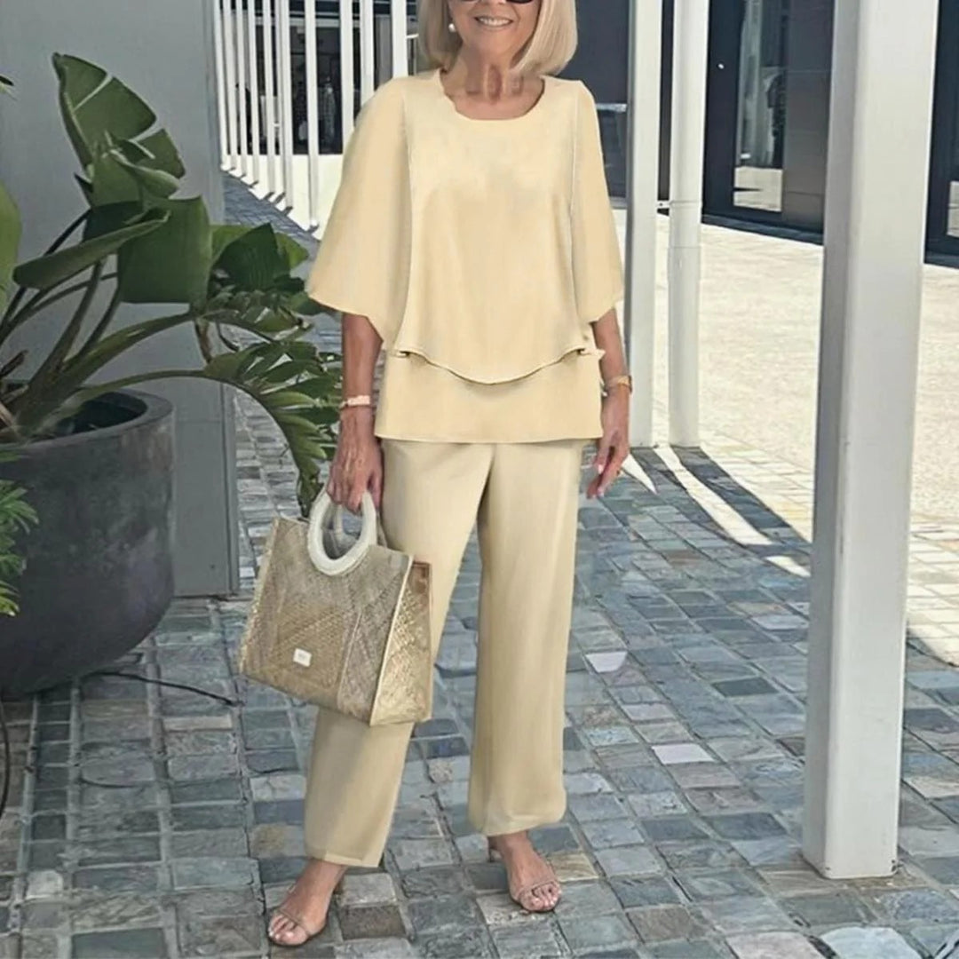Women's layered tunic with cape sleeves and ankle-length straight leg pants with graphic print Mune Fashion