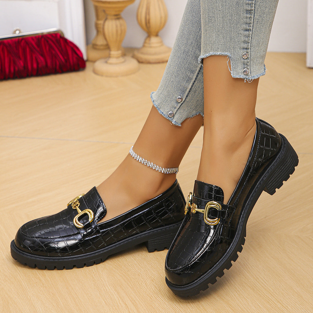 Women's loafers with glossy crocodile embossing, featuring a profiled tractor sole and golden decorative buckle Mune Fashion