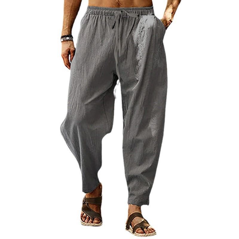 Men's loose linen casual pants with elastic tunnel drawstring waistband, low crotch, and tapered ankle length Mune Fashion