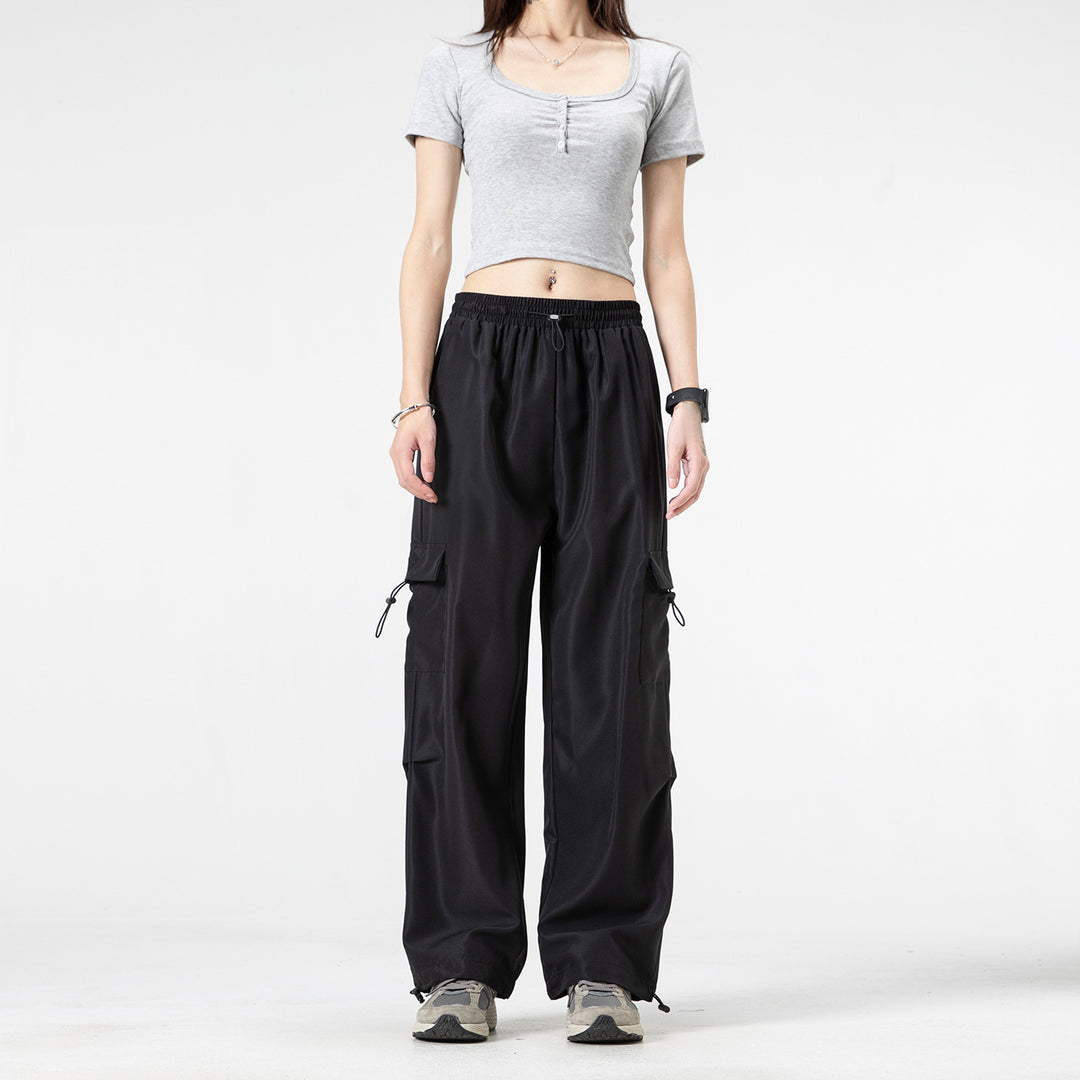 Men's wide technical cargo pants with drawstring waistband, multiple pockets and corded closure Drune
