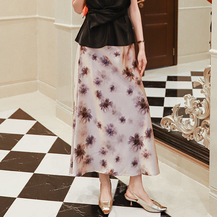 Women's elegant A-line midi skirt with watercolor floral print and fine satin look.