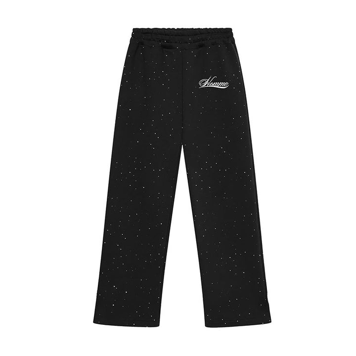 Men's wide comfort trousers with straight leg, elastic drawstring waistband, subtle logo embroidery, and fine speckled look Mune Fashion
