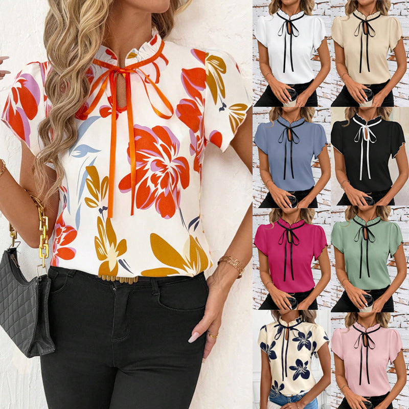Women's short sleeve blouse with ruffled collar, tie band, and floral print Mune Fashion