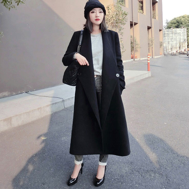 Women's midi-length tailored wool blend long coat with shawl collar, inset pockets, and discreet decorative buttons Mune Fashion