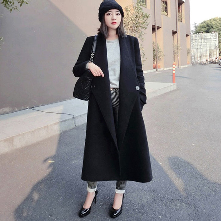 Women's midi-length tailored wool blend long coat with shawl collar, inset pockets, and discreet decorative buttons Mune Fashion