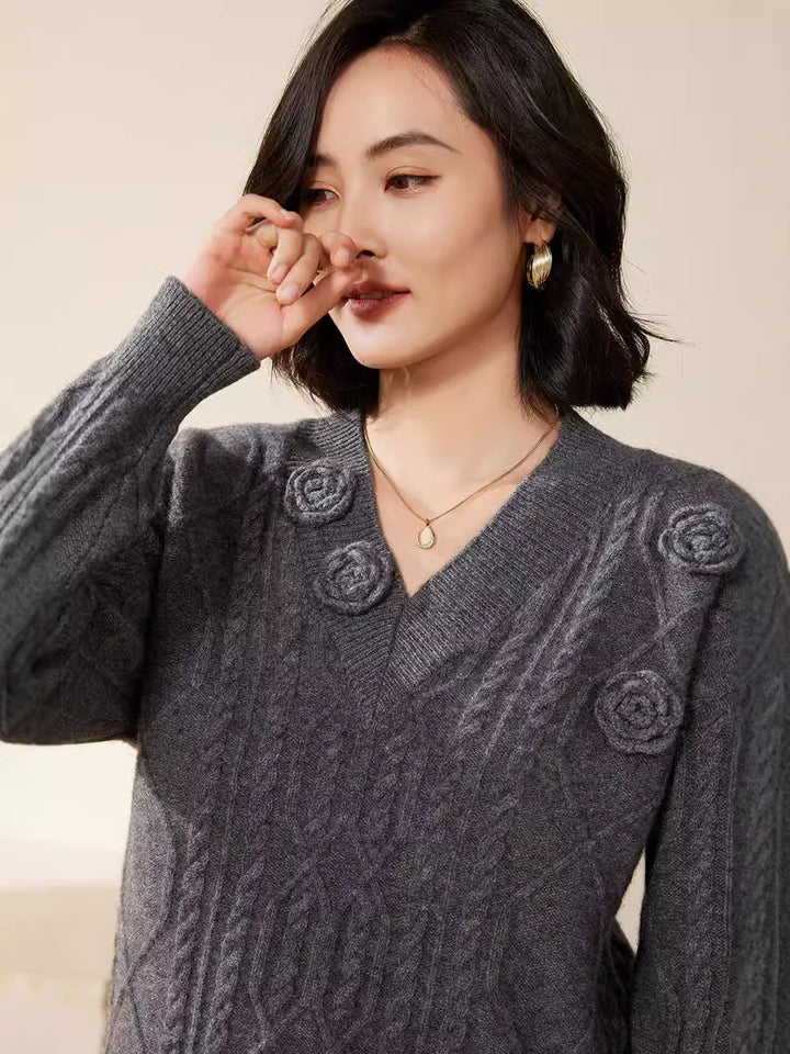 Women's cable knit V-neck sweater with three-dimensional floral appliqués made from soft wool blend Mune Fashion