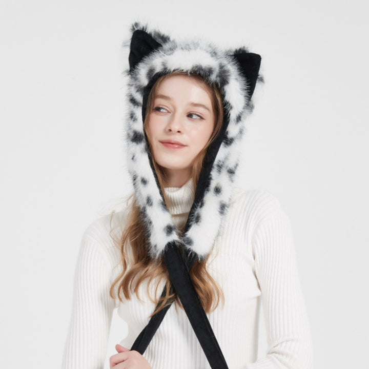 Ladies hooded stole made of luxurious faux fur with long scarf tails and pompom ends Mune Fashion