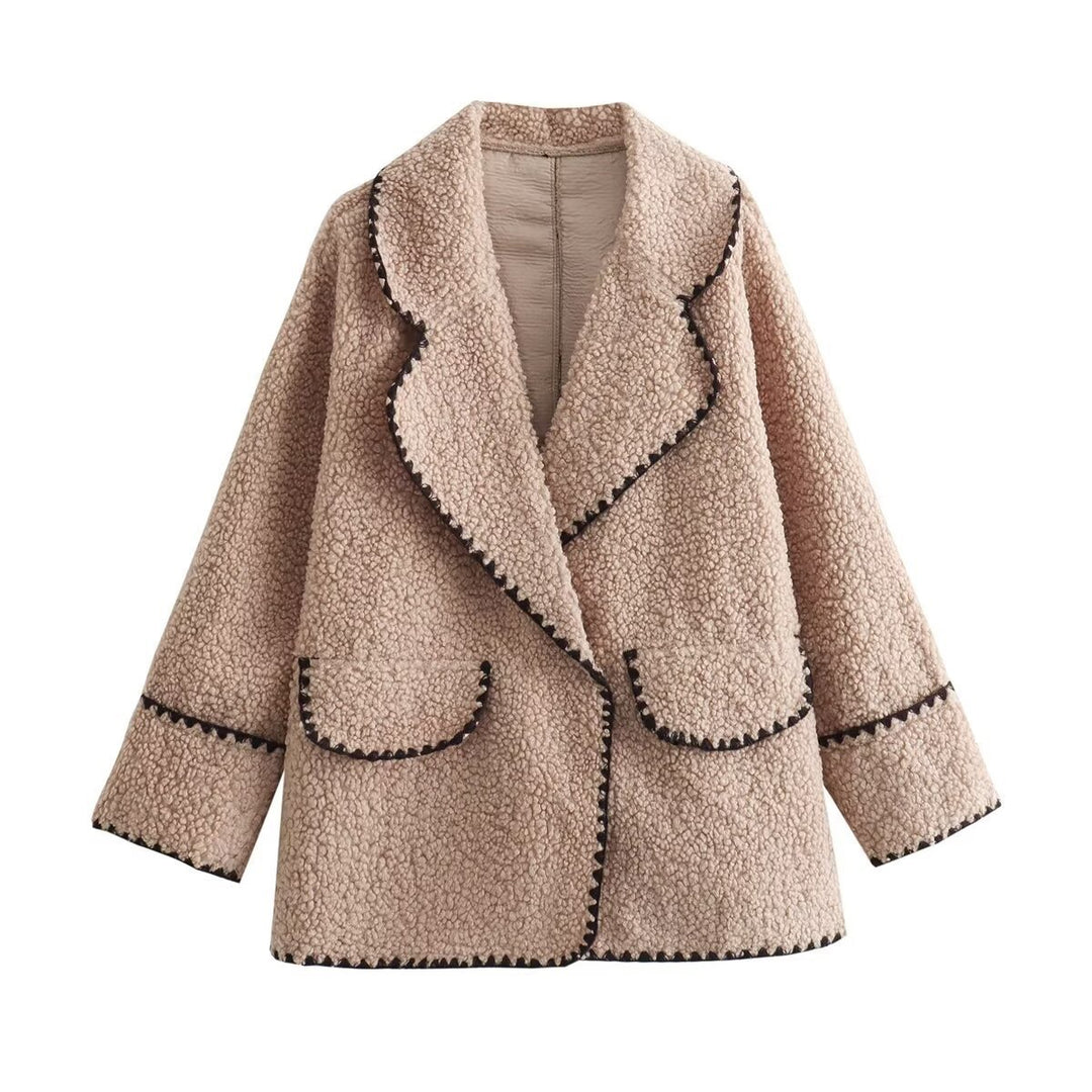 Women’s short cut teddy coat with large shawl collar, patch pockets, and contrasting decorative trim Mune Fashion