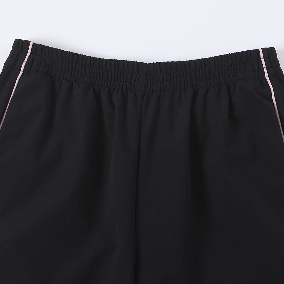 Women wide training pants with contrasting piping and elastic waistband Mune Fashion