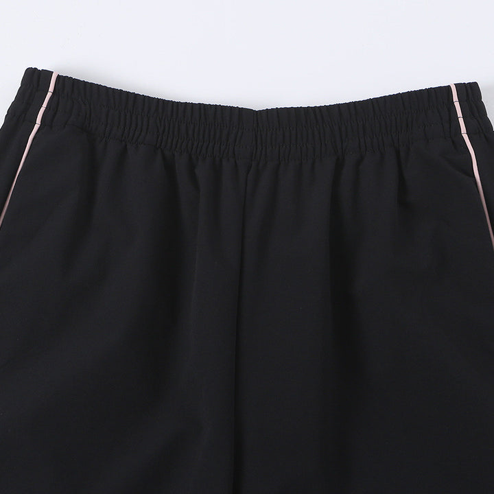 Women wide training pants with contrasting piping and elastic waistband Mune Fashion