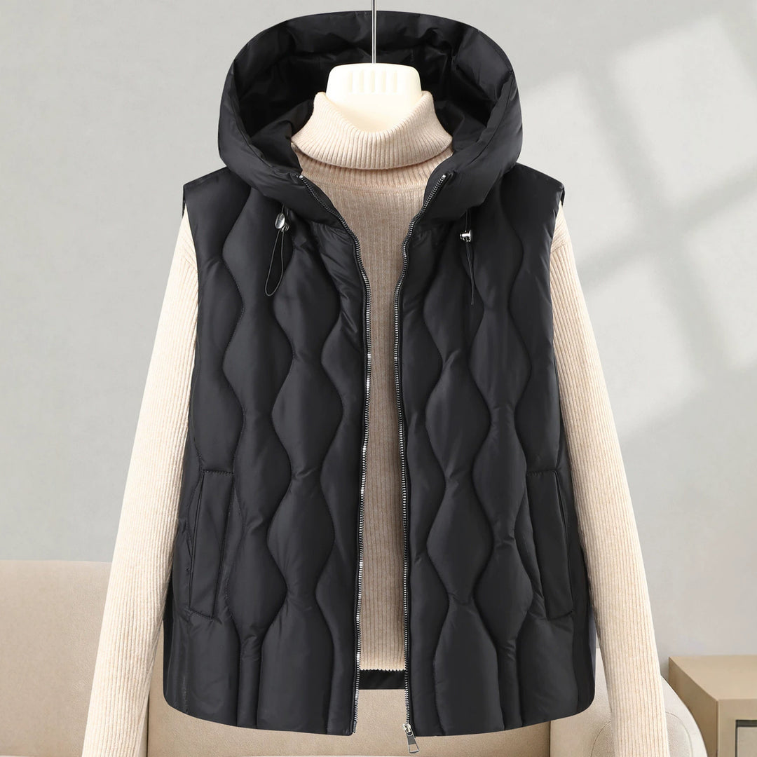 Women longer cut quilted vest with hood, wave quilting and detachable zipper Mune Fashion