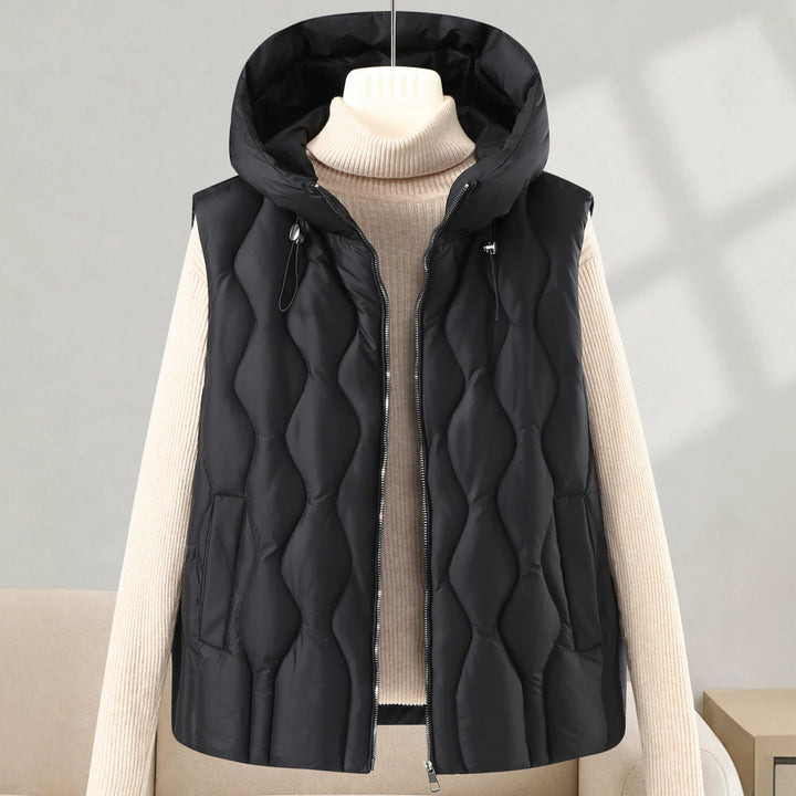 Women longer cut quilted vest with hood, wave quilting and detachable zipper Mune Fashion